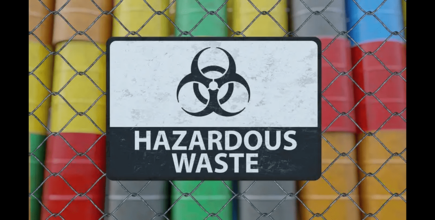 a chain link fence with a sign that says 'hazardous waste'